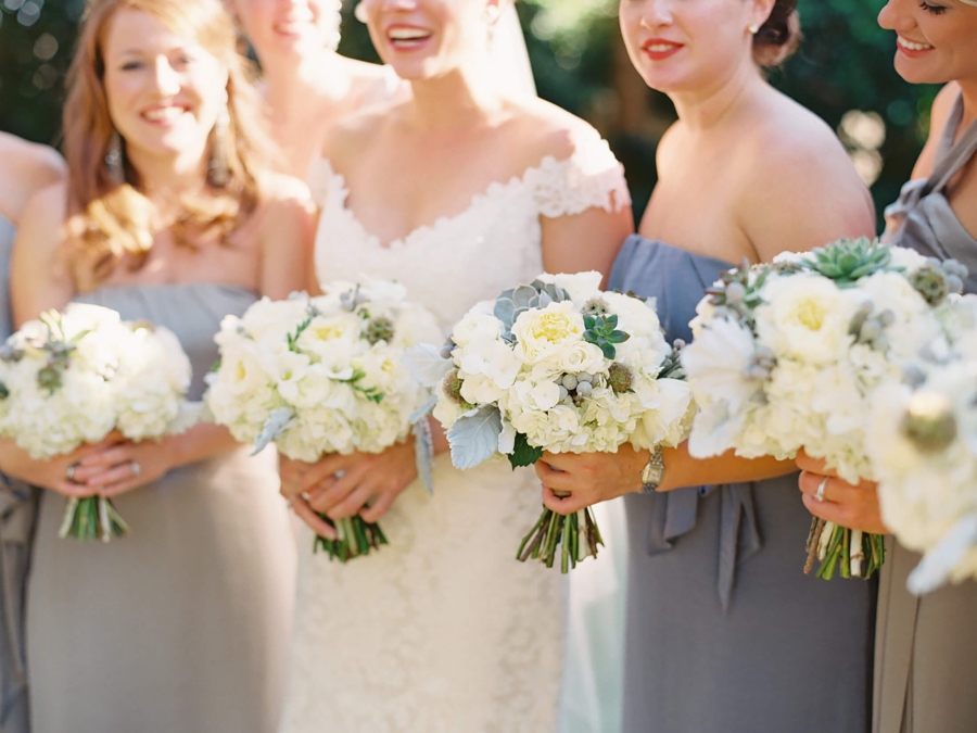 bride and bridesmaids holding bouquets