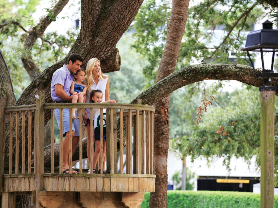 Family standing on a platform  