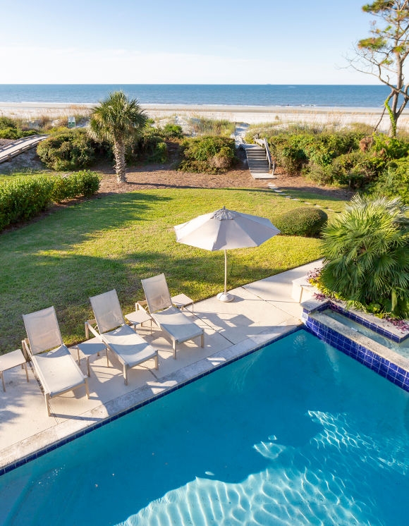 Swimming pool with beach in background