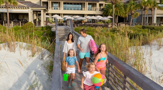 Family walking on a boardwalk 