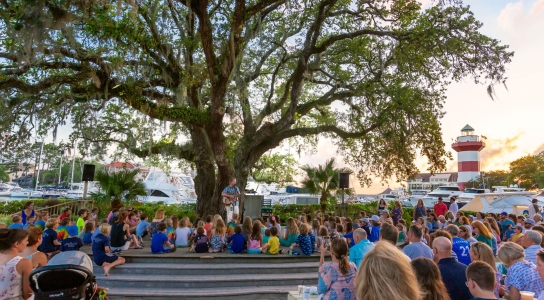 People gathering at a Gregg Russel concert 